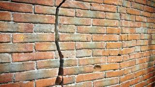 Cracked brick wall